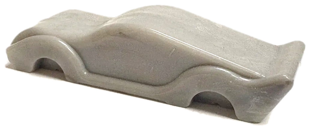 Molded gray car, three-quarter view from the rear